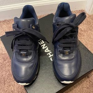 Chanel sneakers, navy blue with original box and duster.